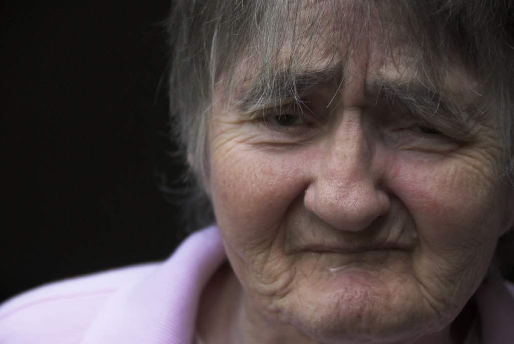 Sad elderly woman