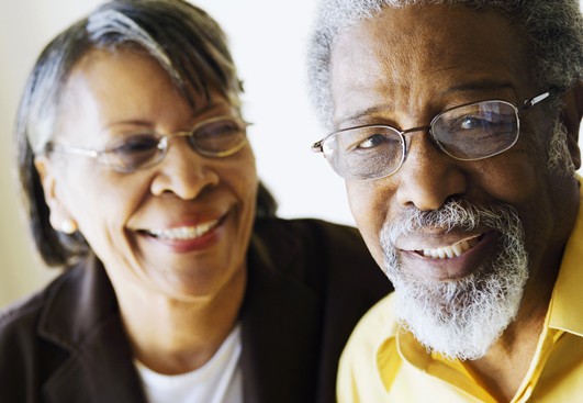 An African-American woman and man, smiliing