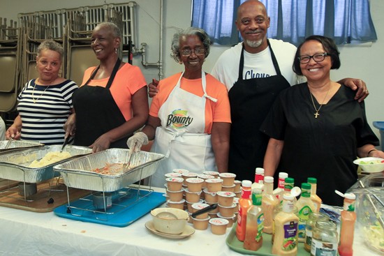 Pictured above (from left) are Margaret Custalow, Tamara Jones, Catherine Gaines, William(Bill) Manson and Rev. Nancy Jackson help to serve a meal to people in need at Zion A.M.E. Church in South Philadelphia. (Photo by Paola Nogueras)