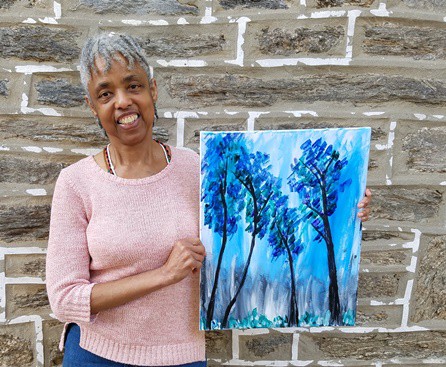 Writer and nascent artist Constance Garcia-Barrio poses with the painting she created in an evening at a Painting with a Twist studio. (Photo by Mike Finnell)