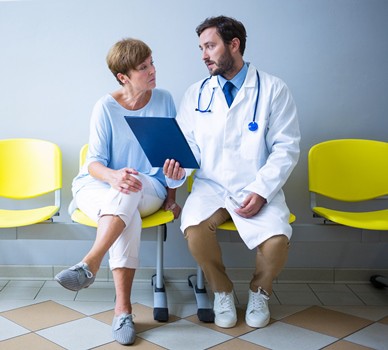CROPPEDDoctor-Woman-Patient-Discussing-Chart_shutterstock_584323645