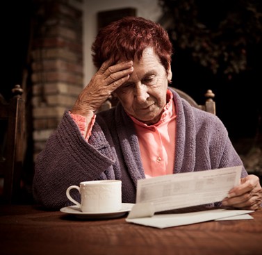 A woman ponders her finances.