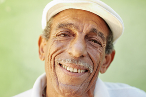 Man with hat smiling