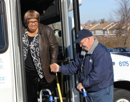 Senior getting off vehicle